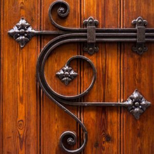 Image of an ornate door lock for the School discipline post